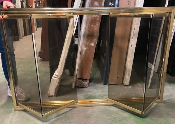 Brass and smoked glass fire screen with wooden handles and double bifold doors, 1140mm wide x 730mm high (F09) $225