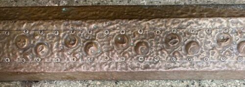 Detail of beaten copper fireplace fender, 1220 W x 320 D x 180 h (F327)
