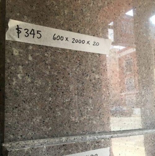 Granite slab or hearth with routed edge. Muted pink, with dark grey and beige flecks. 2000 x 600 x 20mm $345